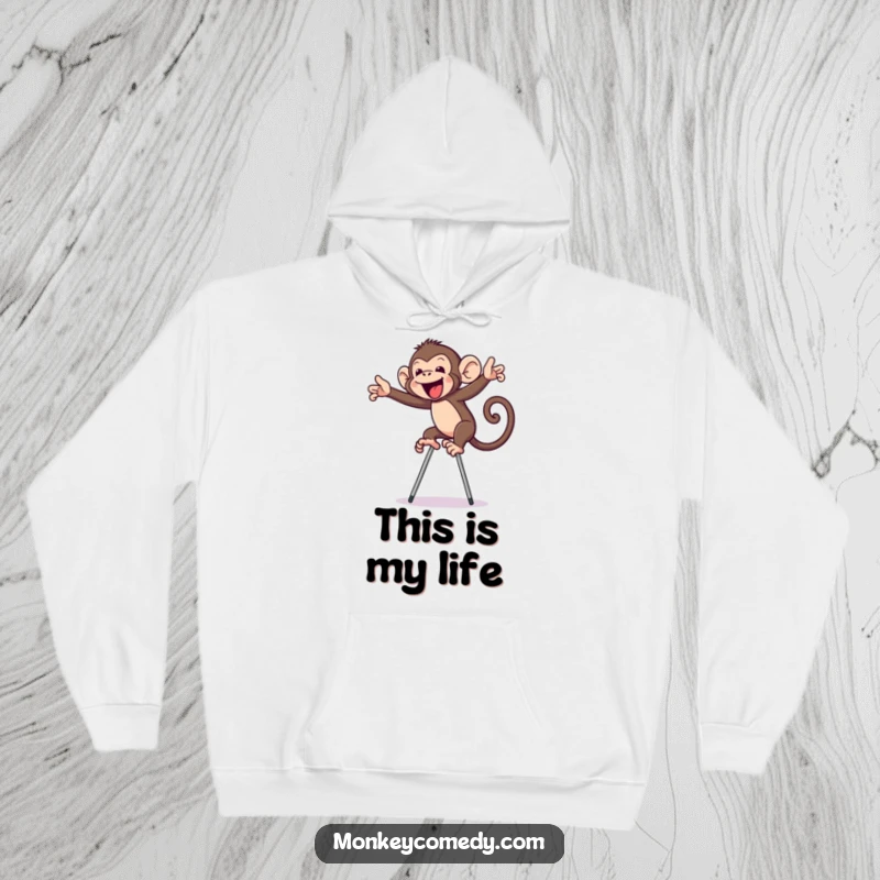 Funny monkey on stilts hoodie, showing a primate hilariously struggling to balance, exuding pure comedic charm and warmth.