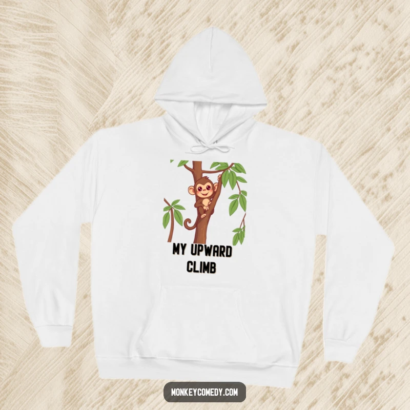 Funny Monkey Hoodie featuring a determined primate climbing a thin tree, offering warmth and motivation.