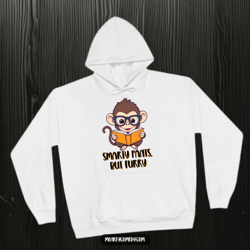 Funny Monkey Hoodie: A humorous monkey wearing oversized glasses is engrossed in reading a tiny book, perfect for intellectual comfort.