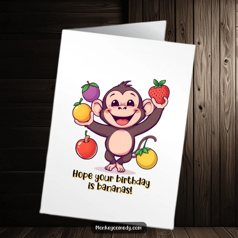 Funny free printable birthday card showing a cheerful monkey with a wide grin, masterfully juggling three colorful fruits, ready for party time.