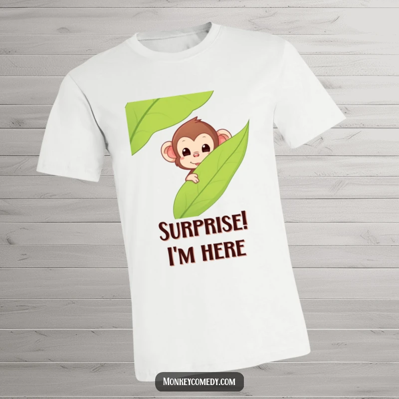 Funny Kawaii Monkey T-Shirt, depicts a cute monkey peeking from behind a large leaf, conveying playfulness and surprise, ideal funny gift.